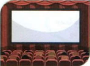 A cinema with a big screen and red seats